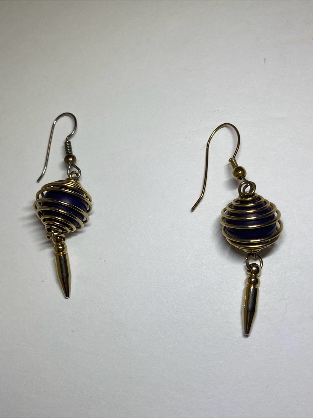 Gold-Tone Spiral Cage Drop Earrings with Deep Blue Bead